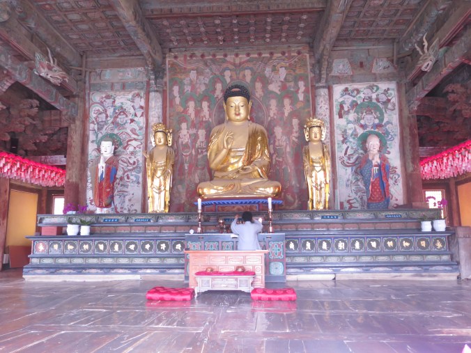 A monk attends prayer